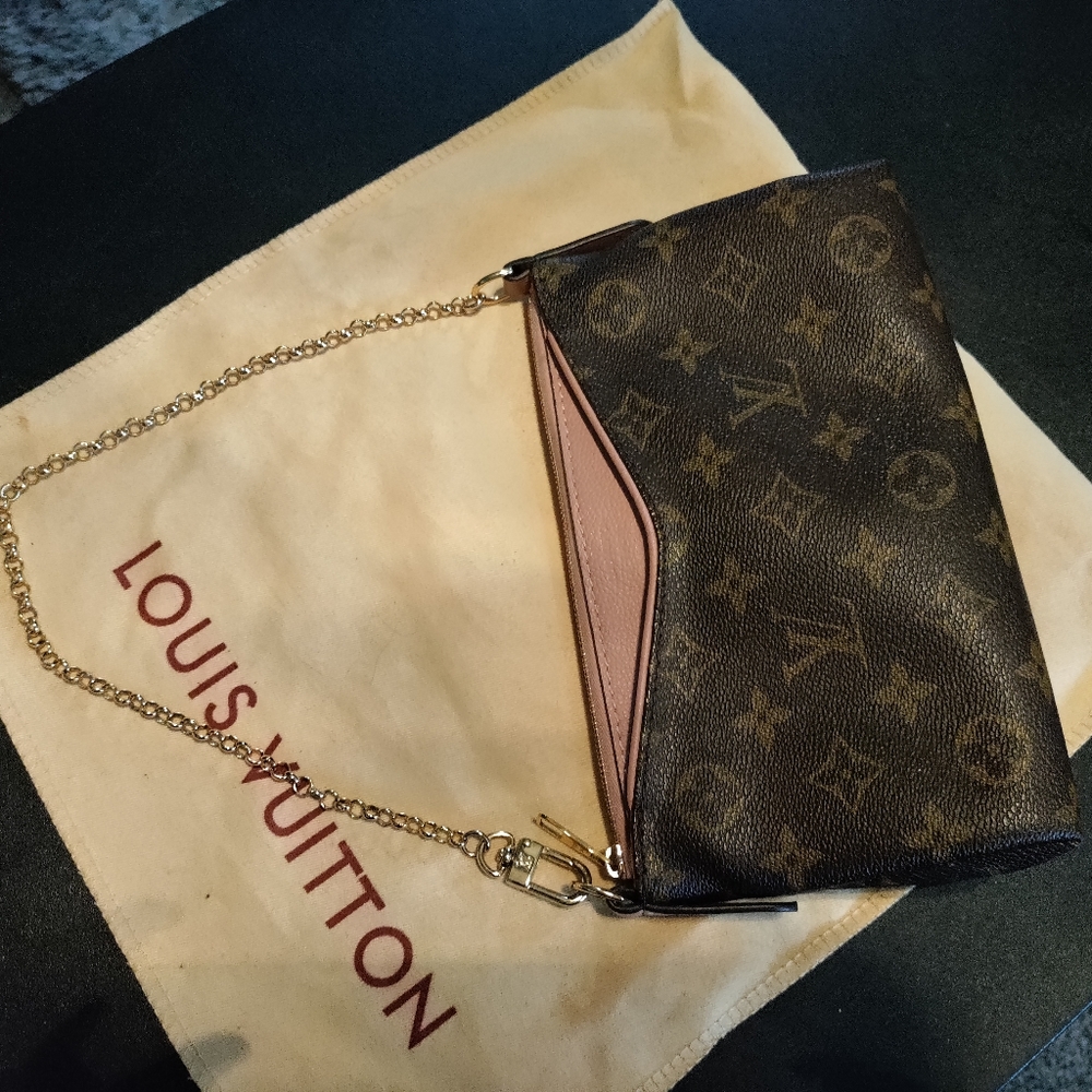 Authentic Louis Vuitton small clutch with chain strap.
